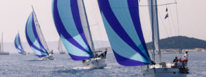 sailing yachts with blue sails