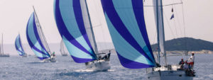 Sailing boats with sails up